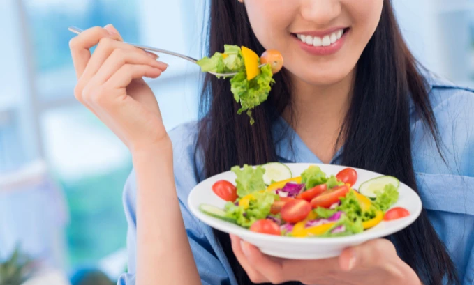 eating vegetable salad