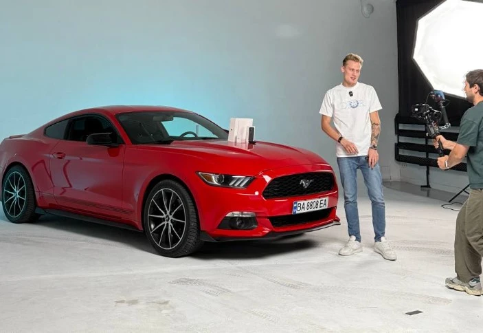 Oleksandr Orlovskyi next to his car