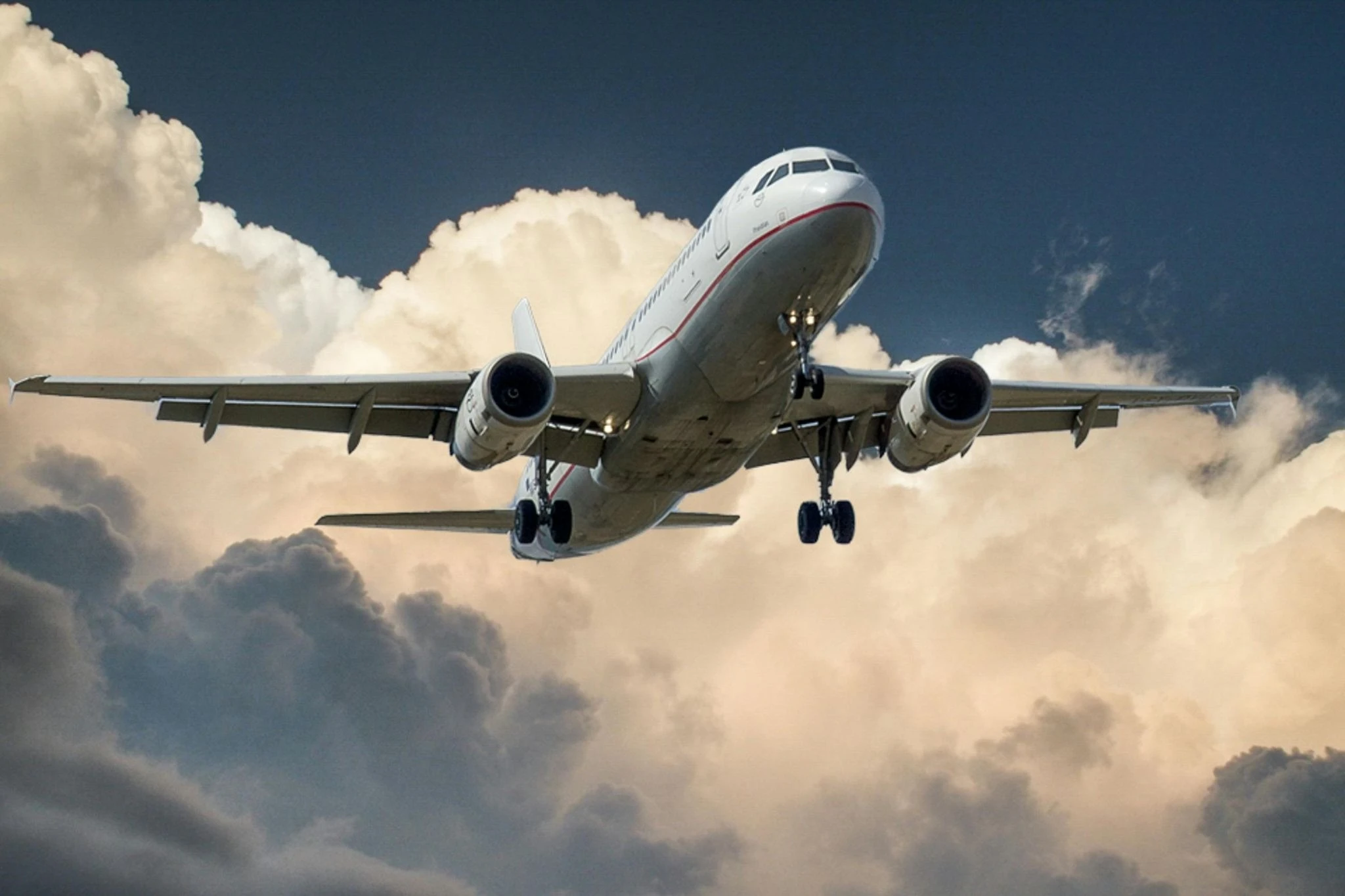 Aircraft flying in the air in the clouds 