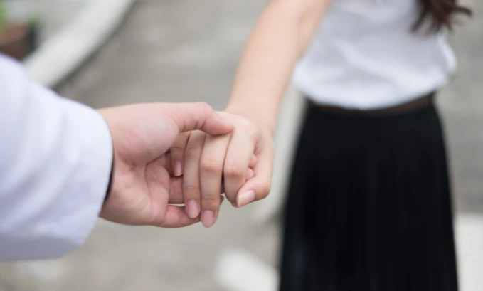 couple holding hands