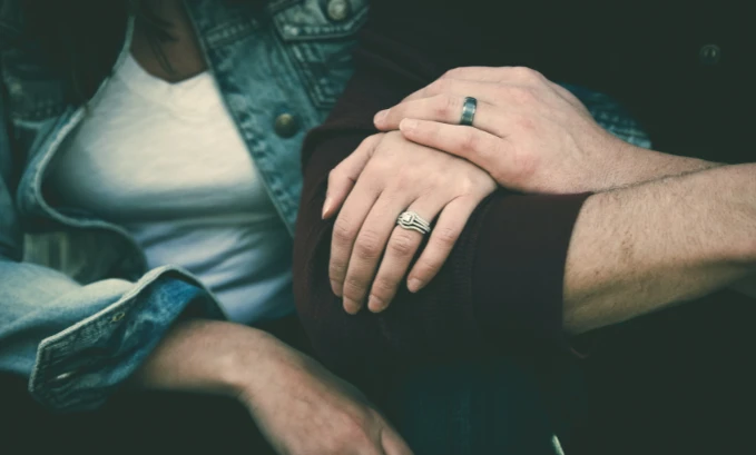 couple hold hands