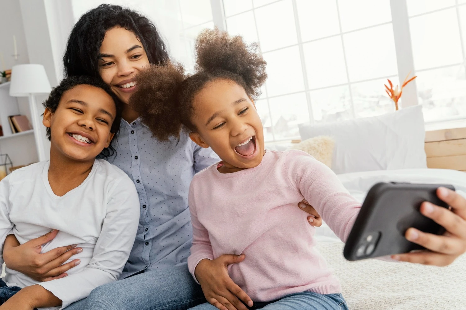 Creating family video masterpieces father and child taking a joyful selfie video at home