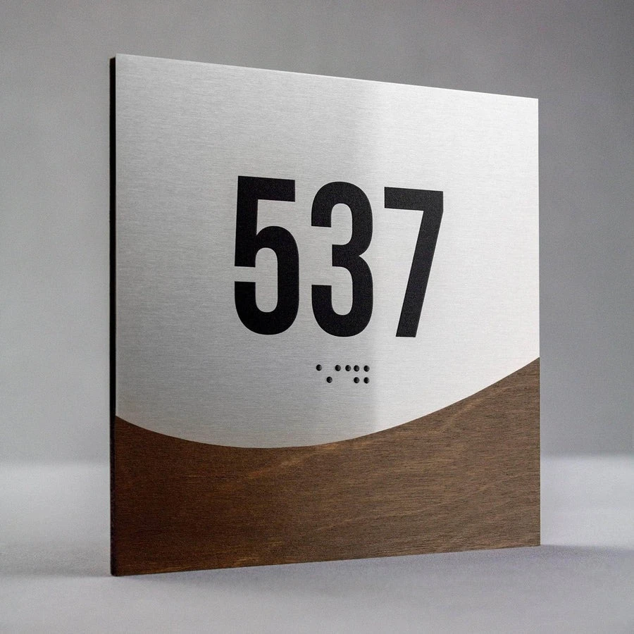 ADA room number sign 537, modern metal and wood door signage with Braille
