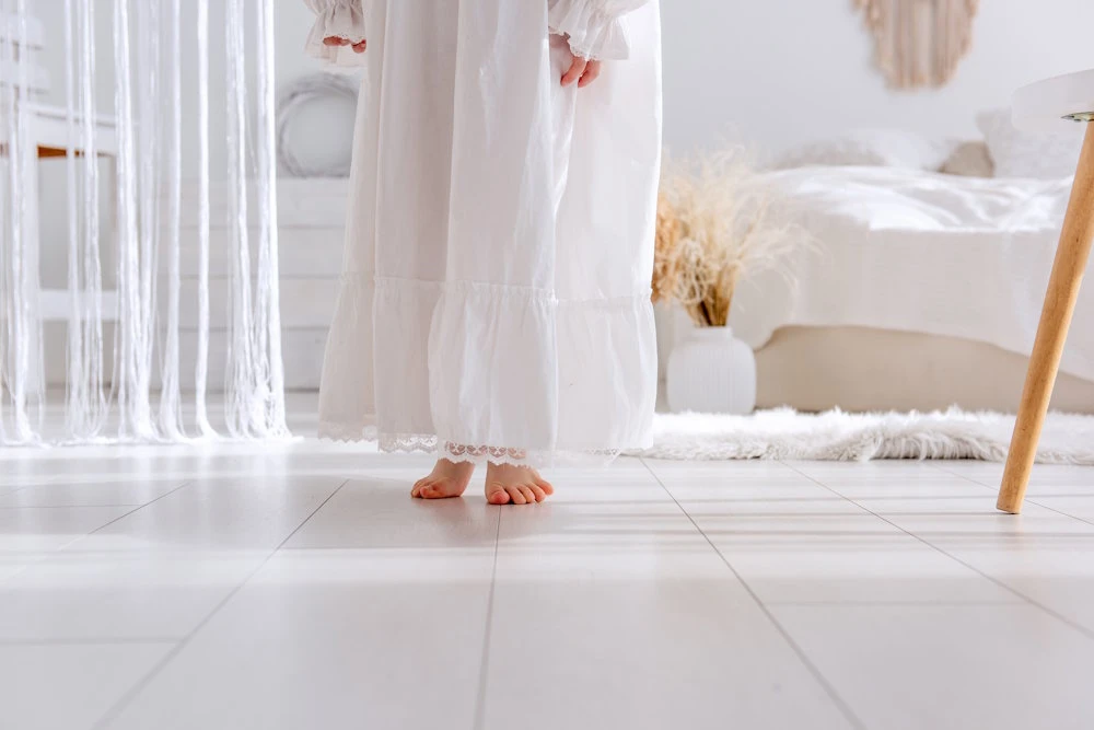 using tiles in the master suite with a rug for warmth