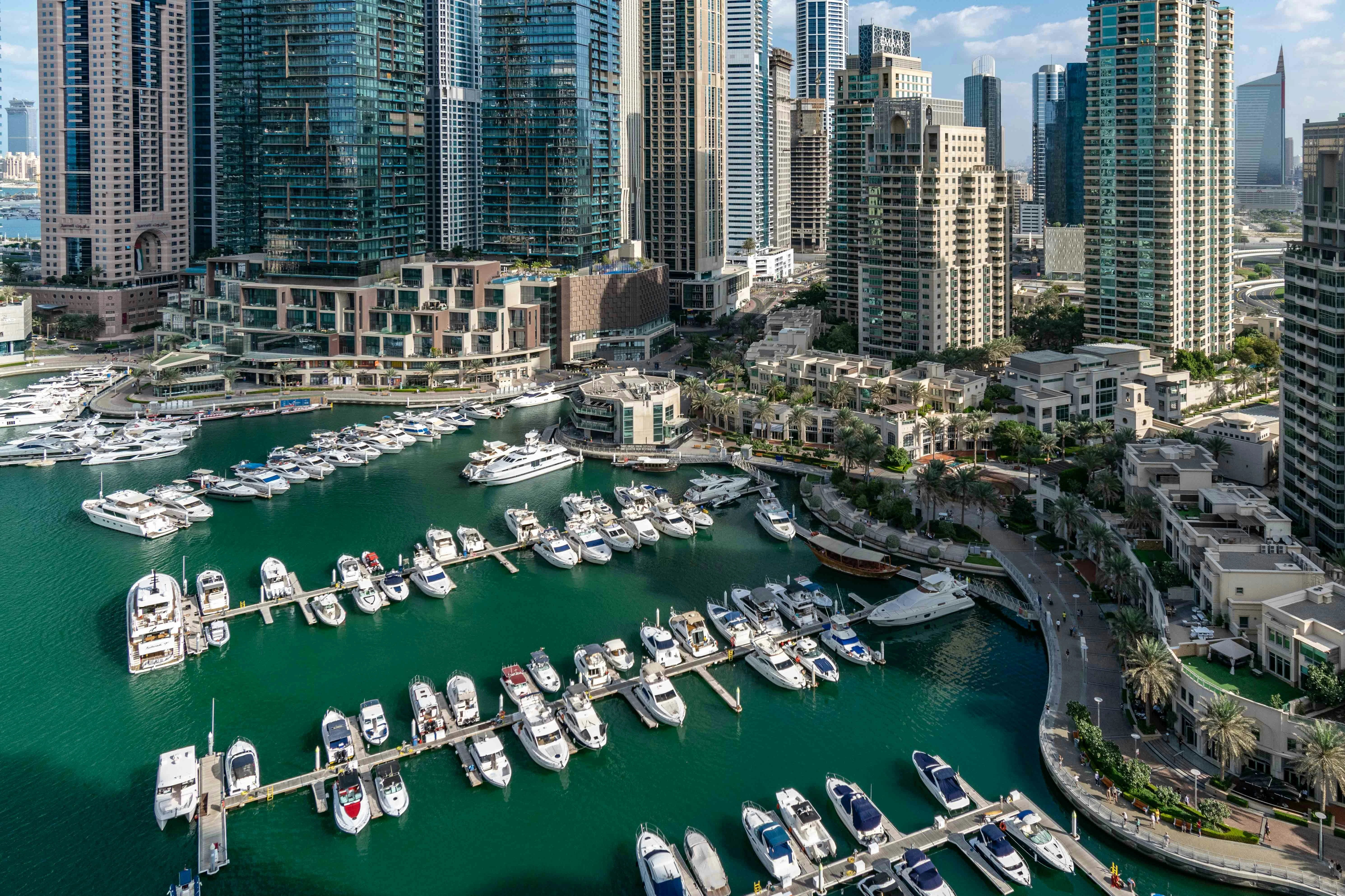 Dubai Marina waterfront with boats and modern residential towers