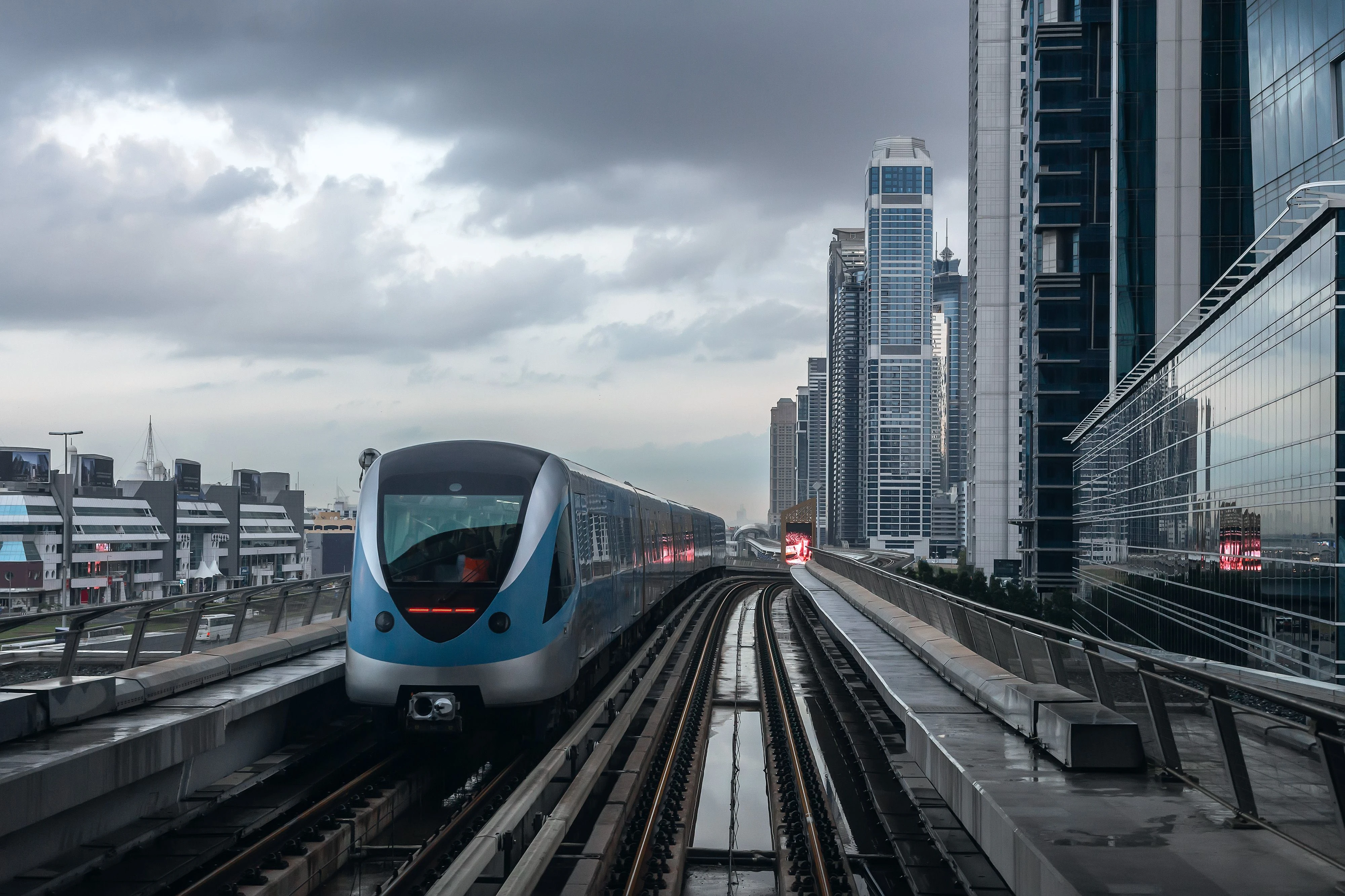 Dubai Metro train travelling through the modern city skyline