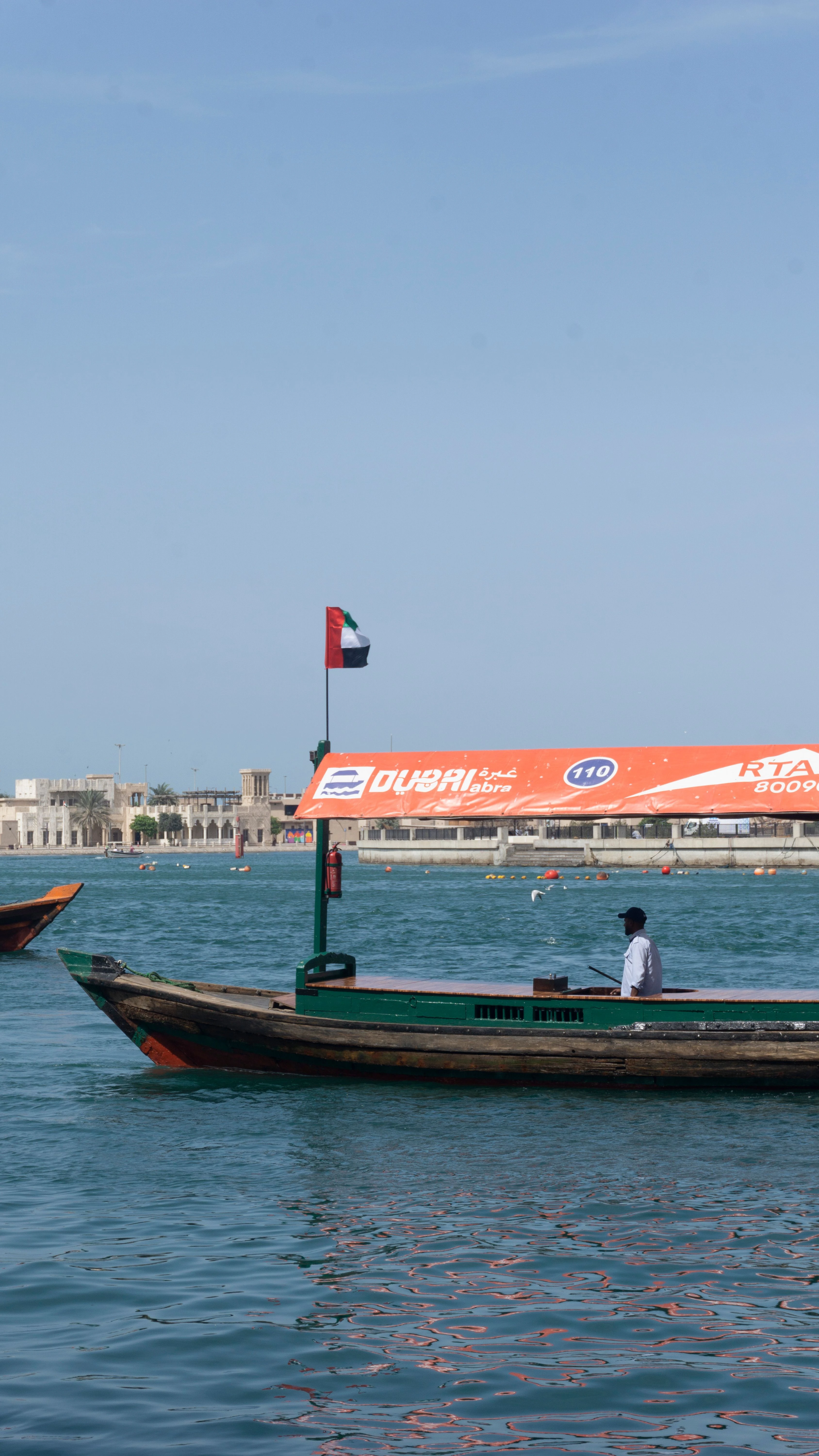 Traditional abra boat crossing Dubai Creek in Old Dubai