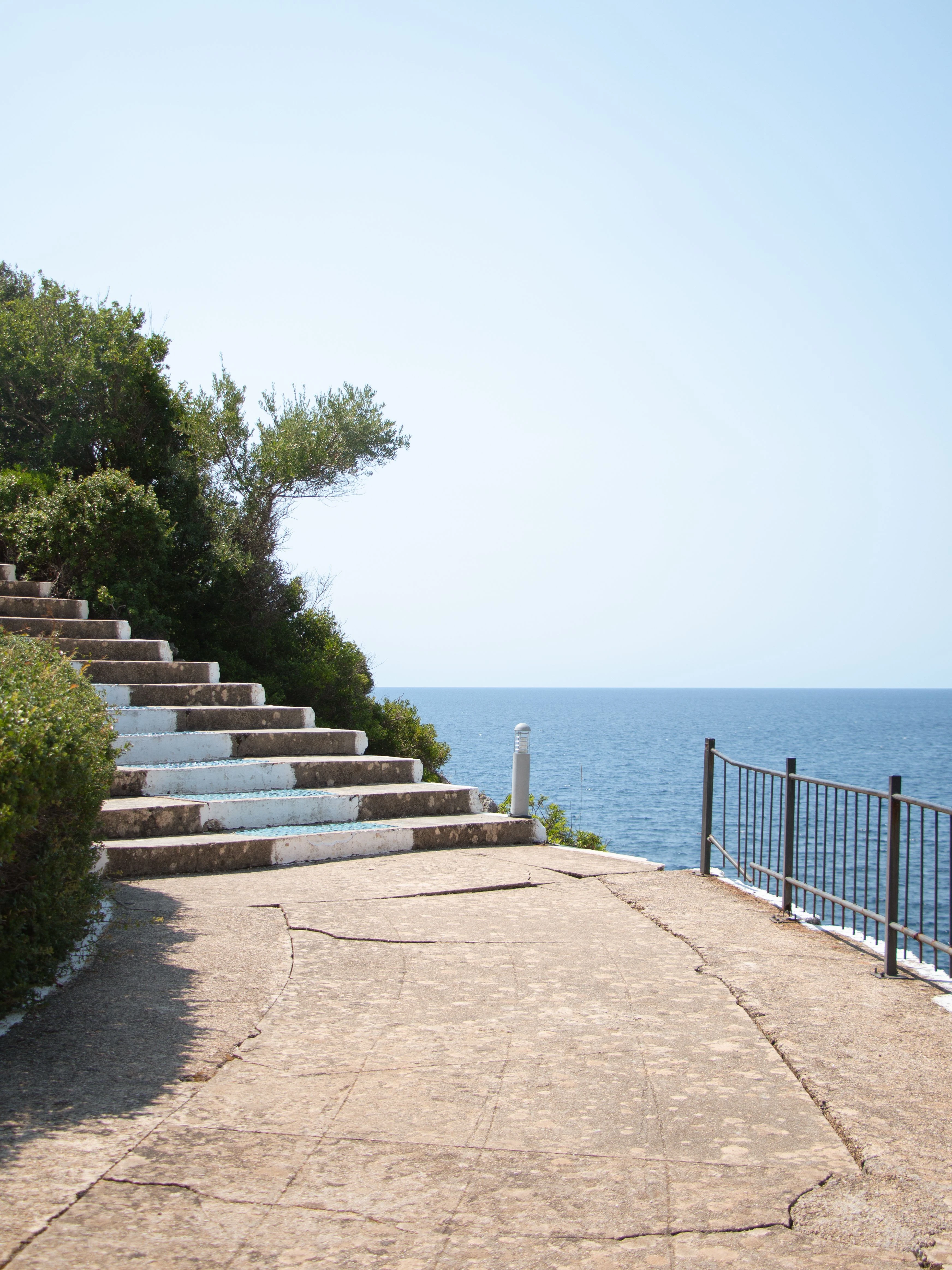 Stone steps and coastal pathway leading toward the sea in Albania