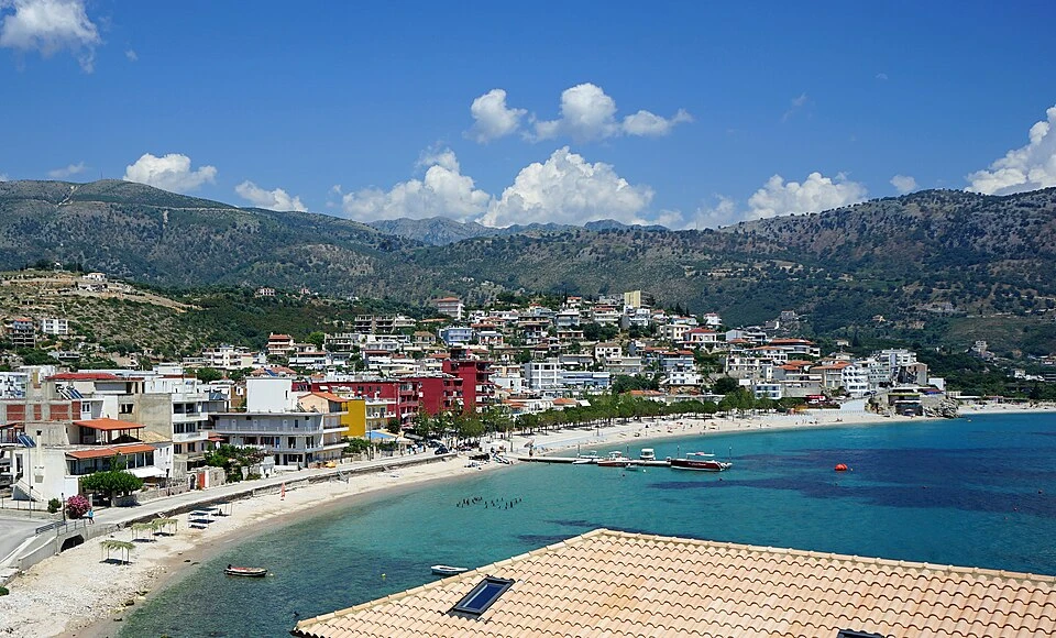 Panoramic view of Himara with its beach, promenade, shops and apartments