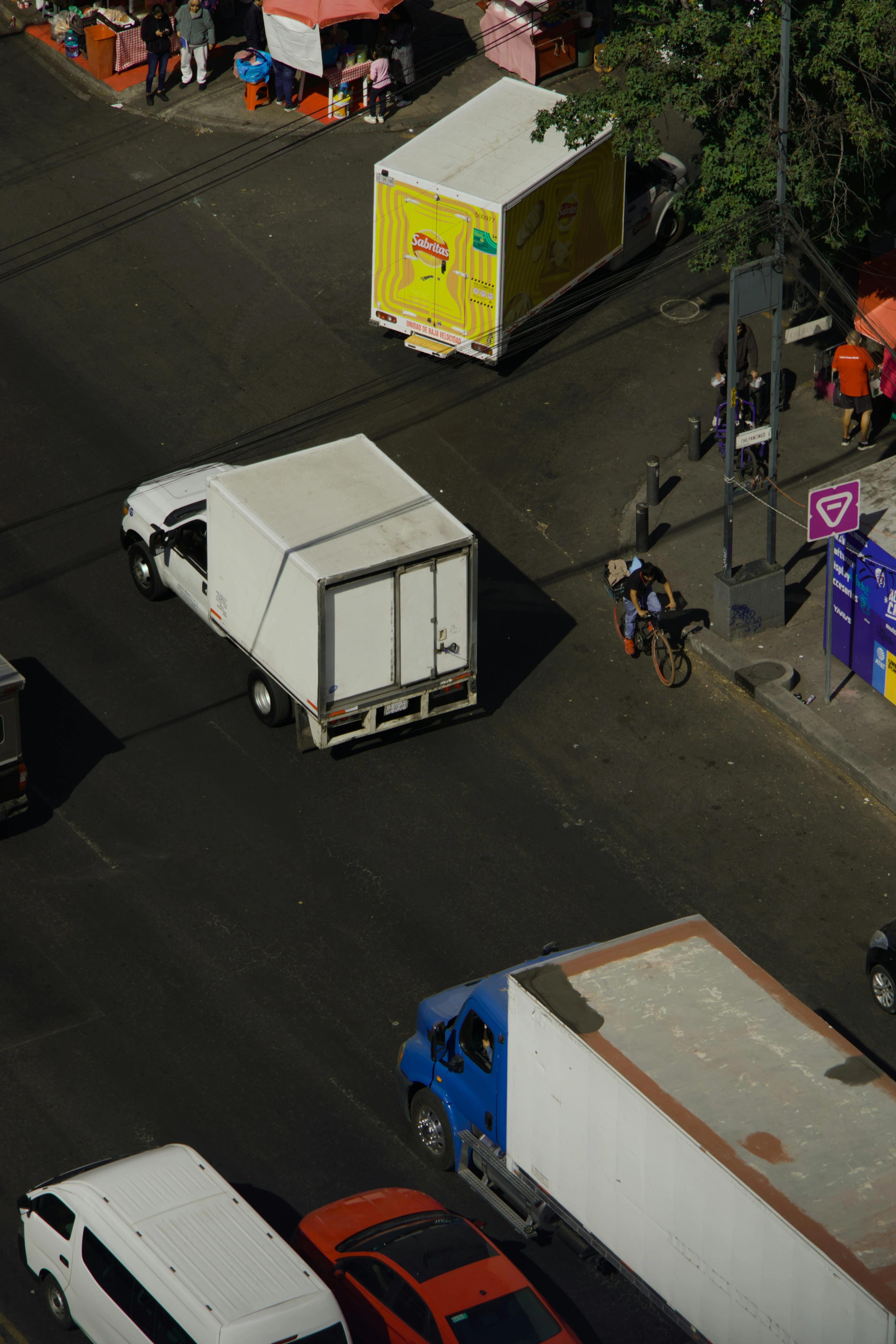 Passenger and logistics vehicles sharing an urban transportation network