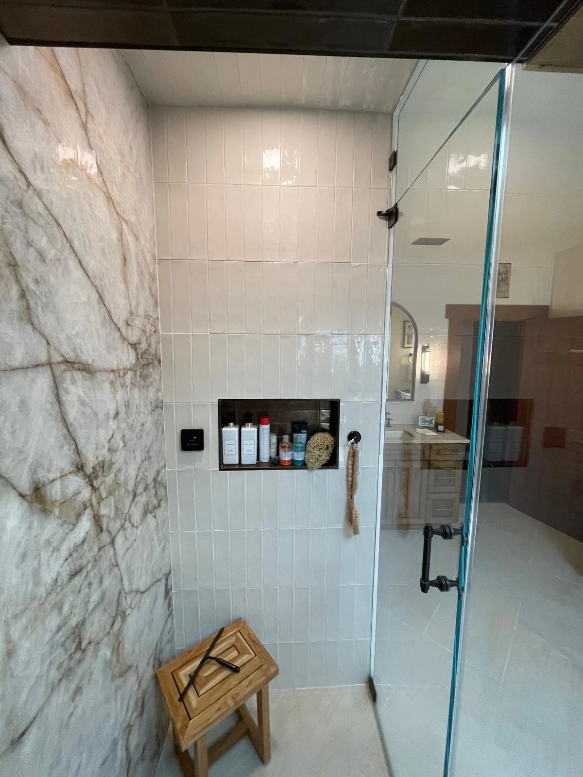 Professional bathroom tile installation process showing proper preparation and tile placement