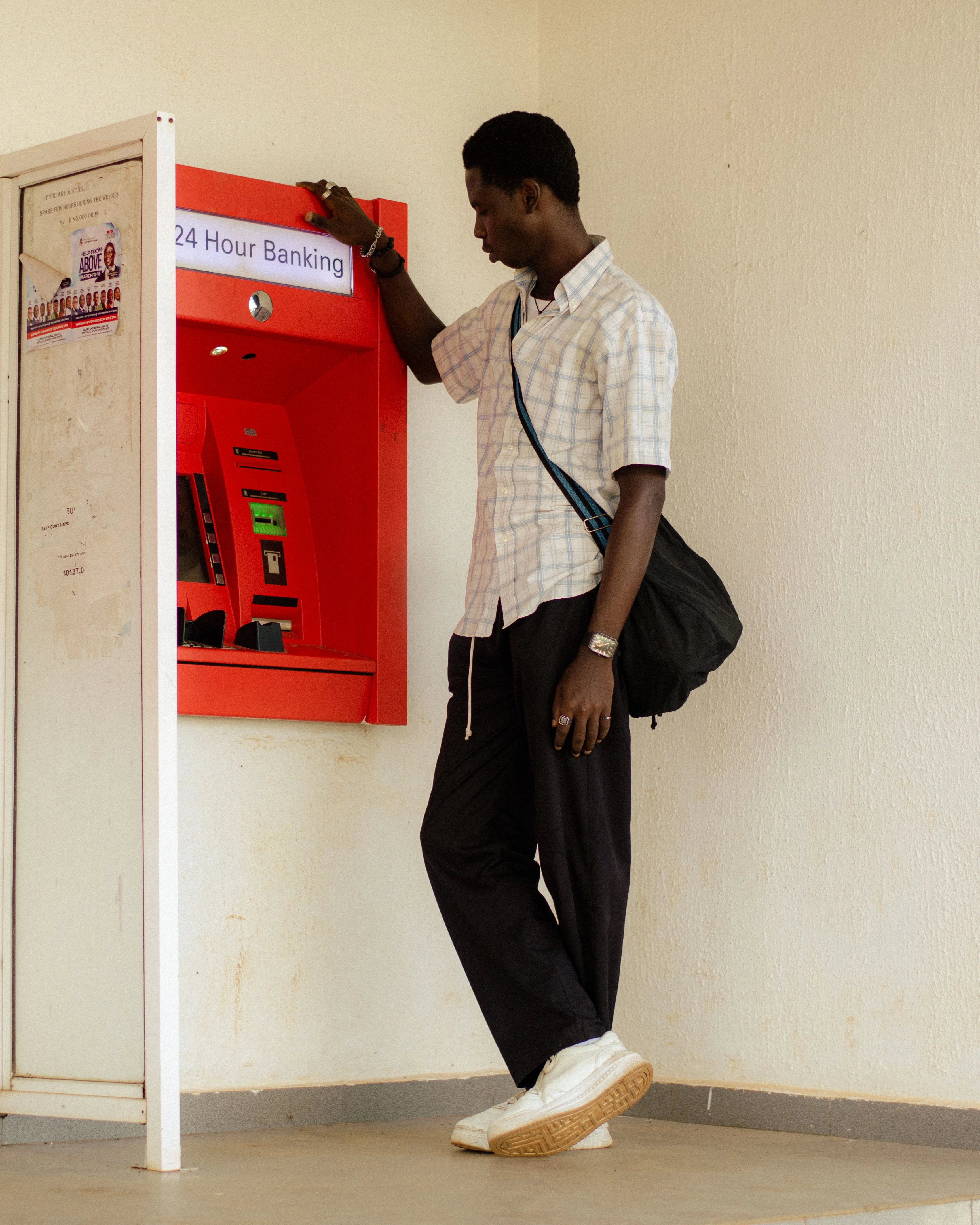 Traveler using an ATM while abroad