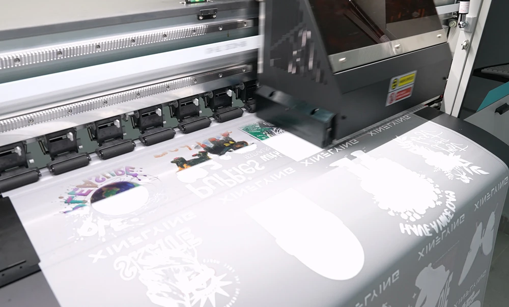 DTF printer producing a colorful transfer film for custom apparel