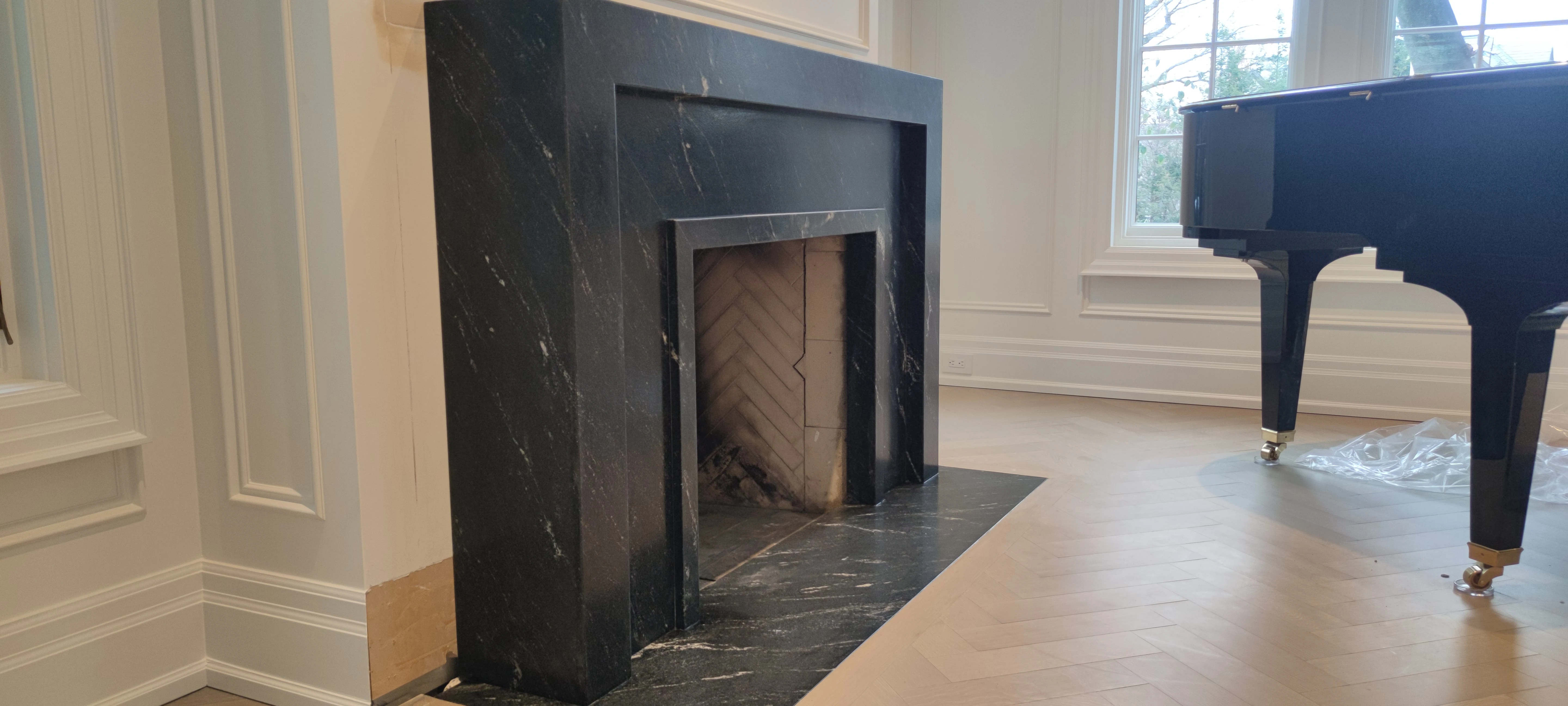 Close-up of mitred edges on a stone fireplace surround